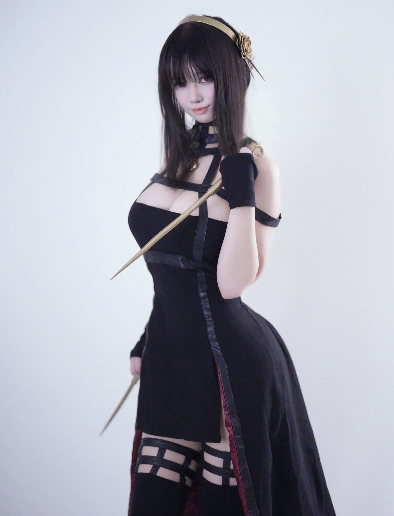 Ari in a black cosplay outfit